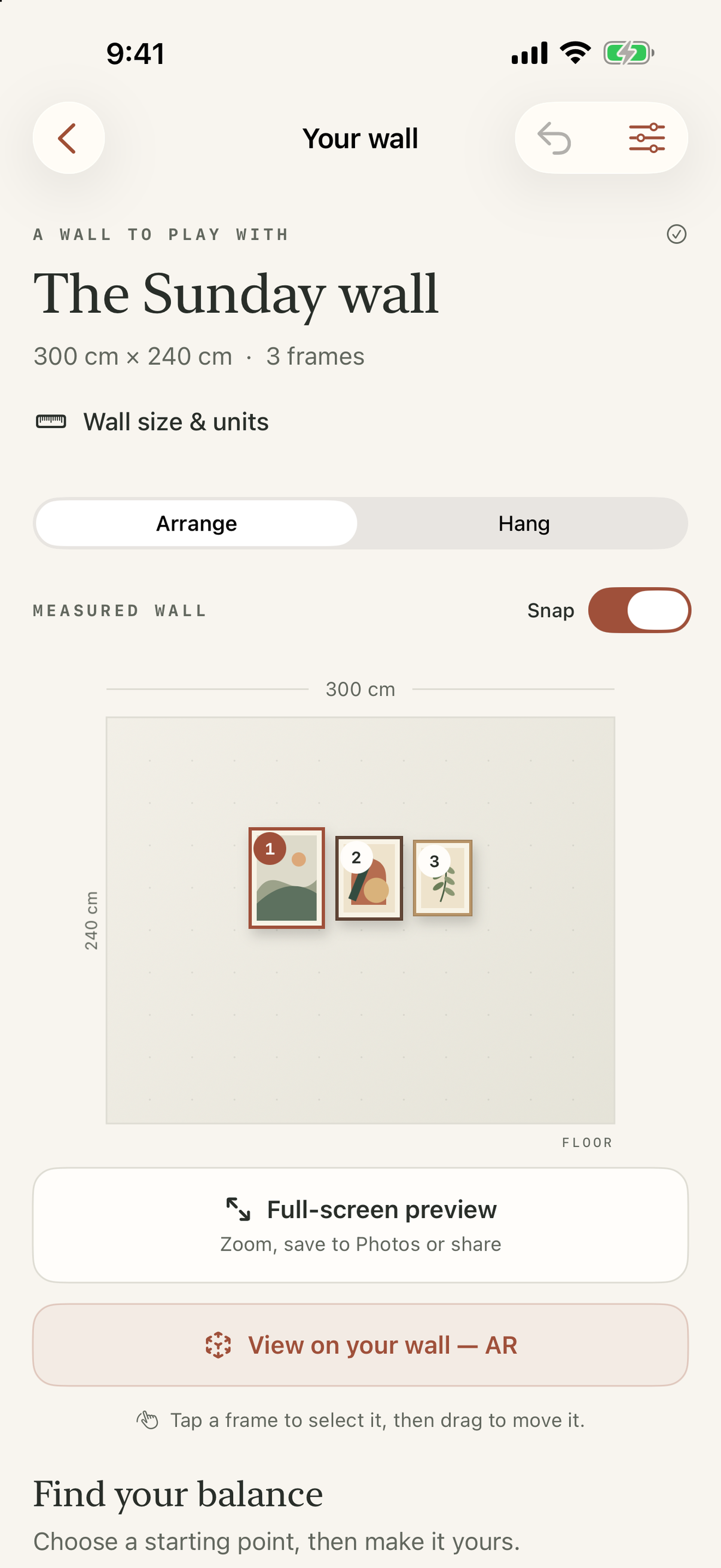 WallHang arrange screen showing three frames on a measured wall